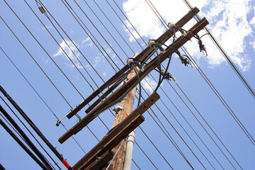 Obraz premium A view of a utility pole and power lines.