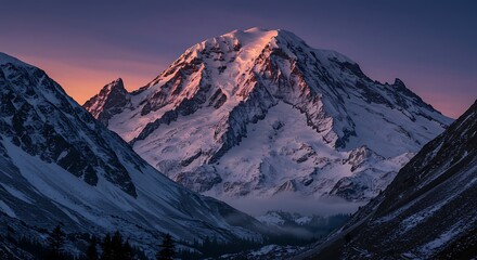 Fototapeta premium Snowy Mountain Peak at Sunset with Valley View