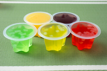 A view of some opened fruit jelly cups.