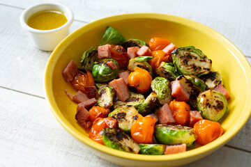 A view of a plate of marinated Brussel sprouts.