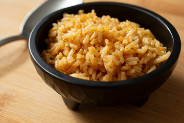 A closeup view of a small bowl of Mexican rice.