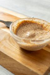 A view of a condiment cup of chipotle dip.