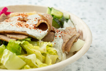 A closeup view of a gyro bowl.