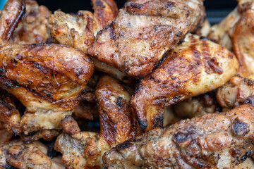 Cooking chicken wings in barbecue