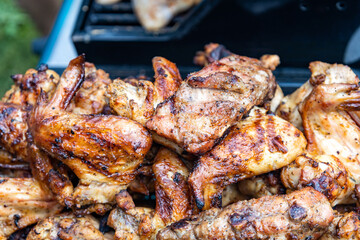 Cooking chicken wings in barbecue
