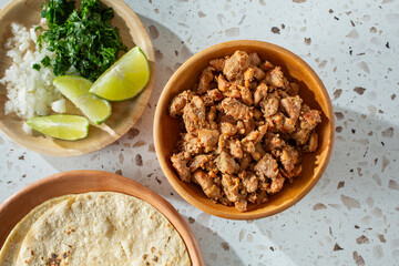A top down view of a bowl of pollo asado.