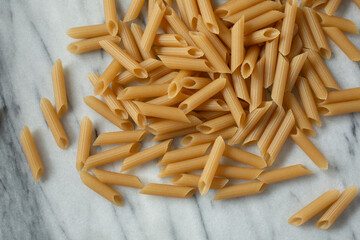 A top down view of a pile of gluten-free penne.