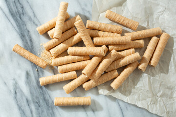 A top down view of a pile of coconut rolls.