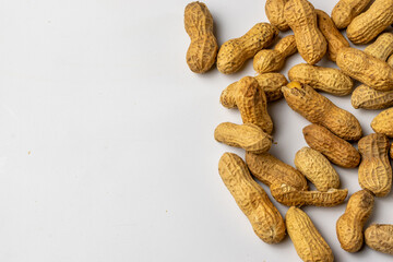 Raw peanuts and white backgroudn