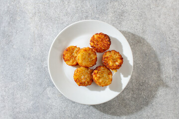 A top down view of some hash brown bites.