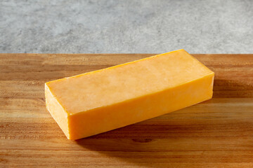 A view of a block of cheddar cheese.