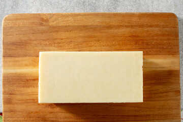 A top down view of a block of Monterey jack cheese.