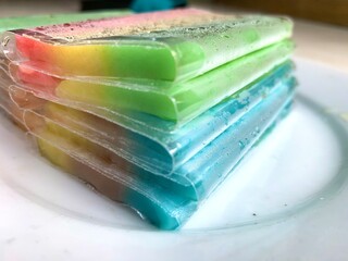 Close up es gabus or rainbow ice is traditional Indonesian food made from sago flour boiled with coconut milk and frozen in the refrigerator. It is delicious, sweet, and have solid texture