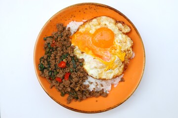 pad kaphrao on a orange plate