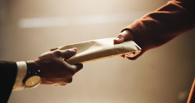 Hands, envelope and bribe in office for corruption, deal and anxiety for money laundering scam at corporate company. Business people, partnership and meeting for cash, secret and payment at agency