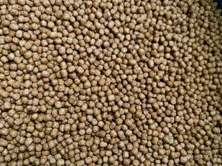 Close up of fish pellets. Food for fish in pond