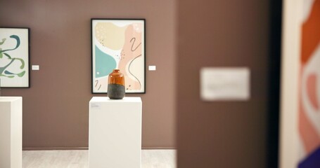 Art, vase and painting in gallery for exhibition, collection or decor in empty interior for culture. Abstract artwork, museum piece and frame with ceramic, sculpture or creative showcase for auction