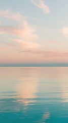 Obraz premium serene, peaceful sea, with still, mirror-like, turquoise water reflecting a warm, soft, pastel-hued sky at sunrise or sunset