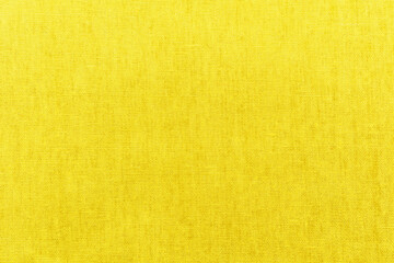 Obraz premium Bright yellow fabric linen texture background