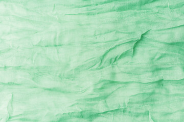 Green   linen fabric texture background close up