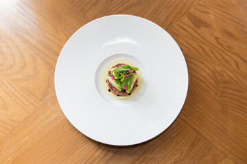Top view of Australian Beef Tartare on wood table