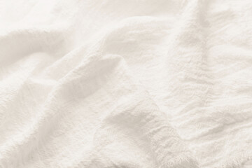 Obraz premium White wrinkled linen fabric texture background close up