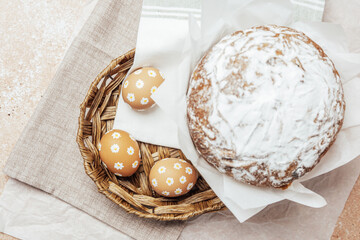Traditional Easter cake with hand-painted daisy eggs on fabric. Homemade festive baked goods and...