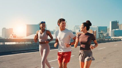 Happy people, fitness or running in city street for exercise, cardio workout or outdoor training. Active group, friends or runners with smile on road for physical health and wellness in an urban town