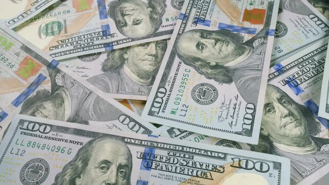 A sizable pile of freshly minted one hundred dollar bills ready for transactions and trade