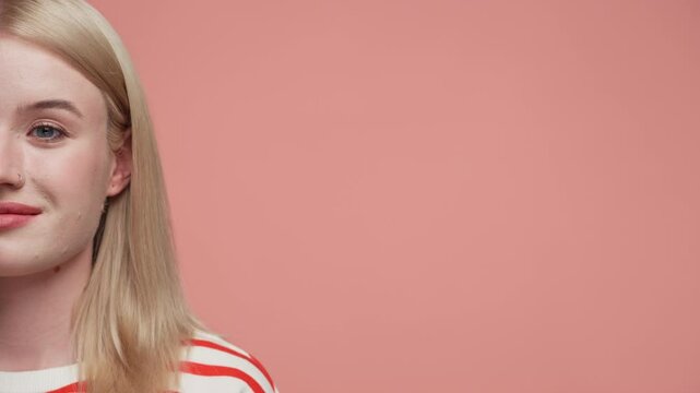 Half portrait of woman with pink background
