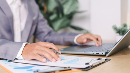 Business Finance, accounting, contract, advisor investment consulting marketing plan. An analyst uses a computer and dashboard for data business analysis.