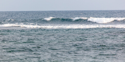 The ocean is calm and the water is blue