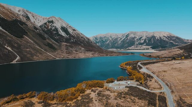 Golden autumn over Lake Pearson, Arthur's Pass. Drone view