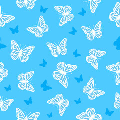 Fototapeta premium butterflies on blue seamless pattern background