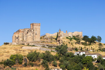 Fototapeta premium Aracena Castle dominating the skyline in Andalusia, Spain, during a sunny summer day