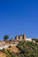 Fototapeta premium Cortegana Castle dominating the skyline of Cortegana village in Andalusia, Spain