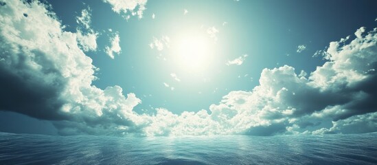 Serene oceanic expanse under a celestial sky with cumulus formations and radiant sunlight