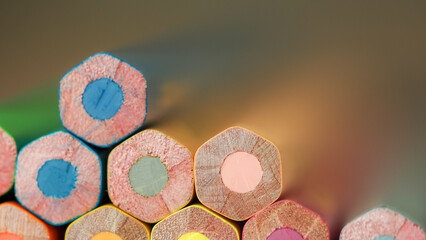 Close-Up of Colored Pencil Ends in a Soft Gradient Background