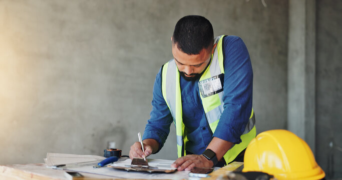 Man, construction worker and writing with clipboard, renovation and notes for safety report at site. Person, engineer and architect with checklist, inspection and space with property development
