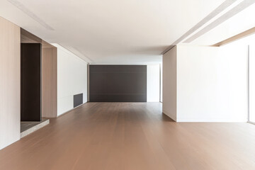 Modern empty living space with warm wood flooring and minimalist design elements
