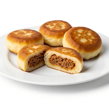 
potato zrazy stuffed with minced meat, on a white plate, isolated on white background