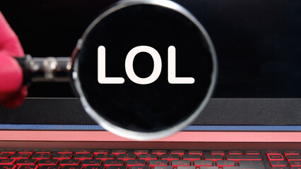 LOL text on the monitor found through a magnifying glass