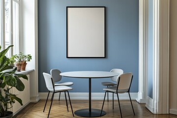 Cozy room with a blank frame, round table and chairs
