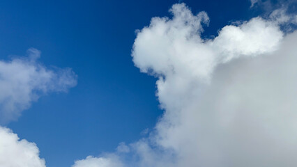 Stunning Aerial View of Cumulus Clouds Against a Vivid Blue Sky