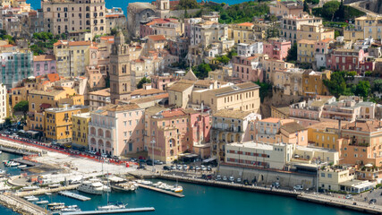 Aerial view of houses and buildings in the historic center of the town of Gaeta. It is located in the province of Latina, Lazio, Italy. The apartments overlook the Mediterranean Sea.