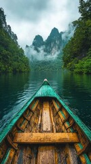 Naklejka premium Serene Boat Journey Through Misty Mountains and Emerald Waters