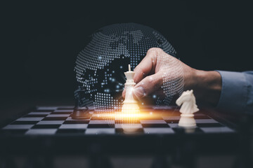 Business strategy and technology concept. Hand holding king chess piece with digital world map, representing global decision-making, innovation, and AI-powered leadership.