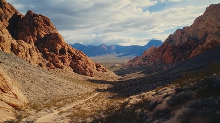 A desert scene with red rock canyons. It shows the beautiful, rocky landscape.
