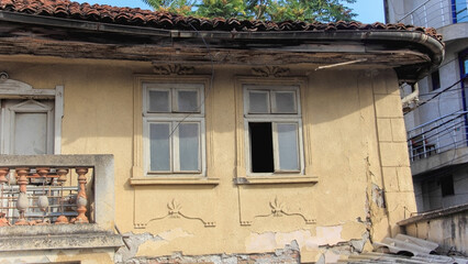 A view on a facade and windows of an old house i Kosovska Mitrovica.