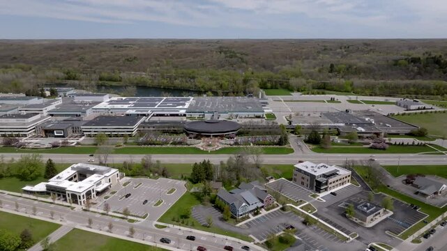 Amway North American Headquarters building in Ada, Michigan with drone video moving in.
